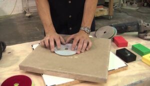 demonstrating how to use diamond polishing pads